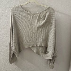 Beige waffle knit sweater with open twist back